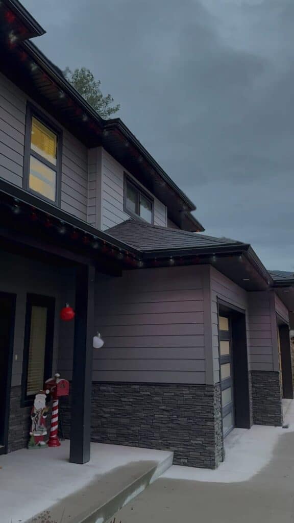 Nelson home roofline at dusk before permanent LED lights are switched on