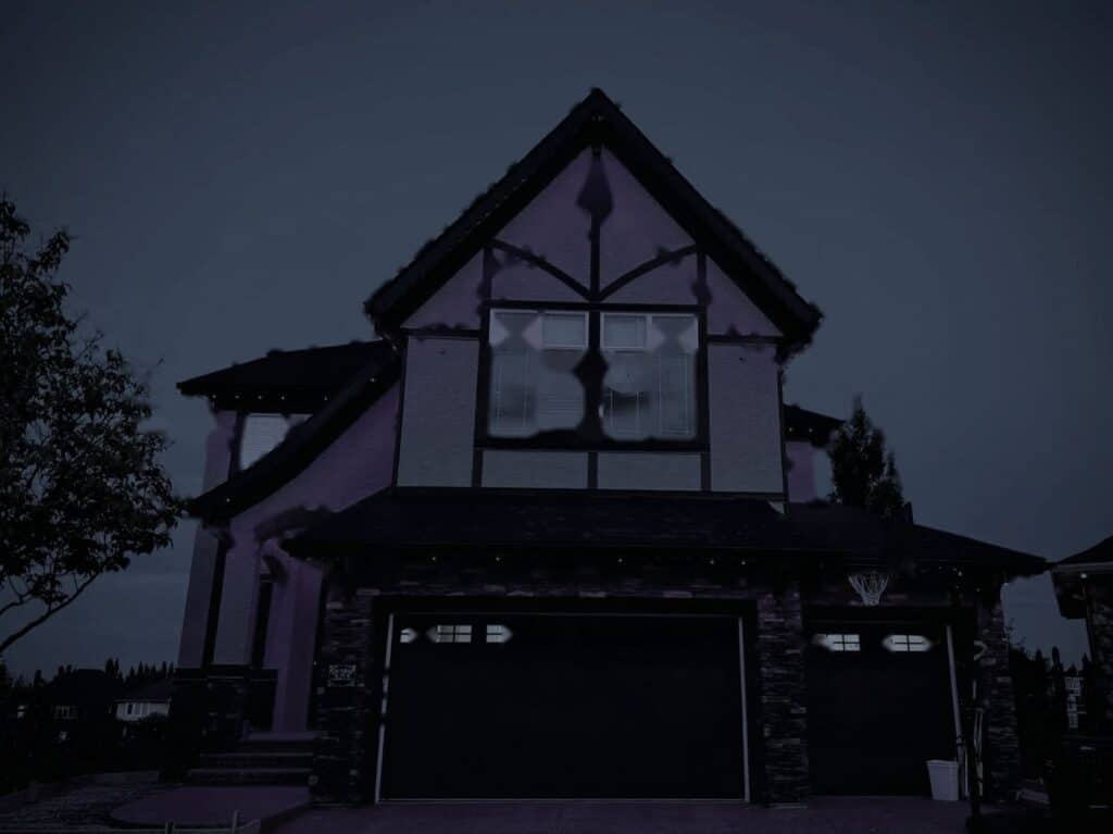 Tudor style home at night before lighting