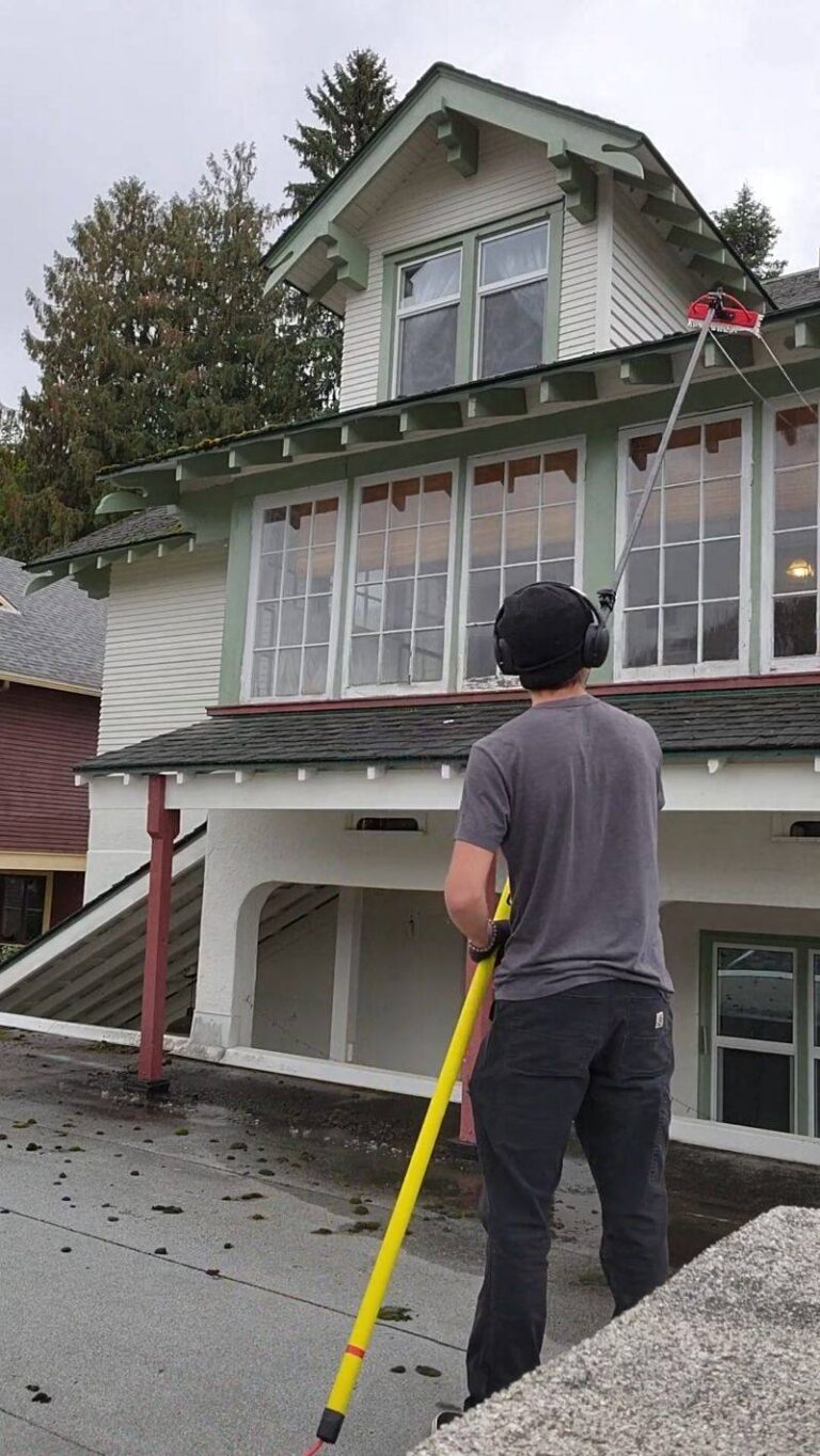 Window cleaning on a heritage home in Nelson BC